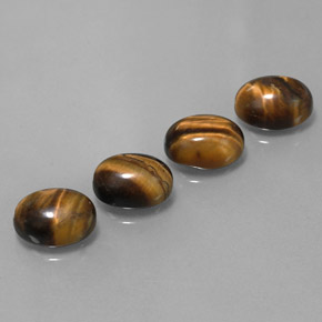 Натуральный коричневый tiger's eye 8,36 карата огранка овал, непрозрачный