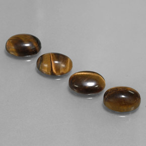 Натуральный коричневый tiger's eye  карата огранка овал, непрозрачный