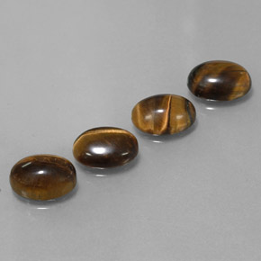 Натуральный коричневый tiger's eye  карата огранка овал, непрозрачный