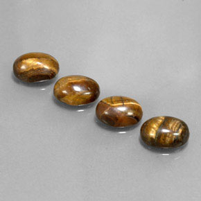 Натуральный коричневый tiger's eye  карата огранка овал, непрозрачный