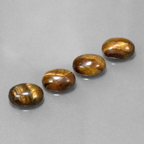Натуральный коричневый tiger's eye  карата огранка овал, непрозрачный