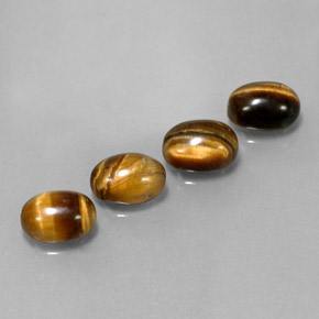 Натуральный коричневый tiger's eye  карата огранка овал, непрозрачный