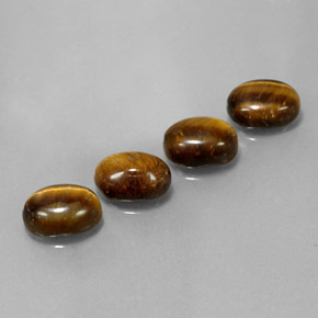 Натуральный коричневый tiger's eye 6,65 карата огранка овал, непрозрачный