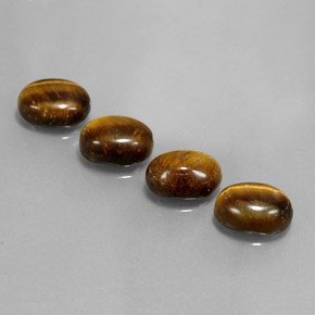 Натуральный коричневый tiger's eye 6,65 карата огранка овал, непрозрачный