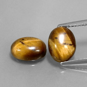 Натуральный коричневый tiger's eye  карата огранка овал, непрозрачный