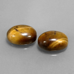 Натуральный коричневый tiger's eye  карата огранка овал, непрозрачный