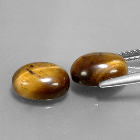Натуральный коричневый tiger's eye  карата огранка овал, непрозрачный