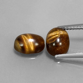 Натуральный коричневый tiger's eye  карата огранка овал, непрозрачный