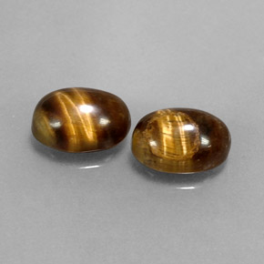 Натуральный коричневый tiger's eye  карата огранка овал, непрозрачный