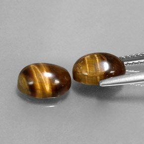 Натуральный коричневый tiger's eye  карата огранка овал, непрозрачный