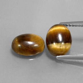 Натуральный коричневый tiger's eye  карата огранка овал, непрозрачный