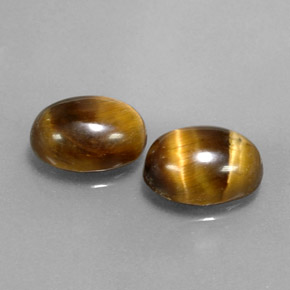 Натуральный коричневый tiger's eye  карата огранка овал, непрозрачный