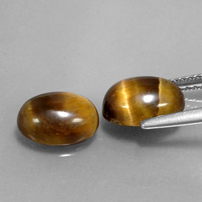 Натуральный коричневый tiger's eye  карата огранка овал, непрозрачный