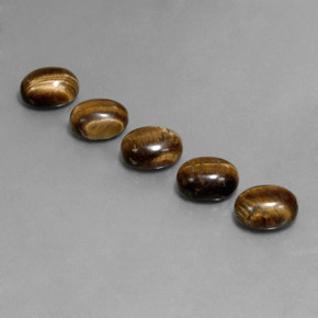 Натуральный коричневый tiger's eye 10,03 карата огранка овал, непрозрачный