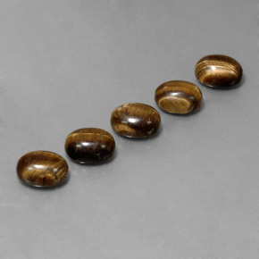 Натуральный коричневый tiger's eye 10,03 карата огранка овал, непрозрачный