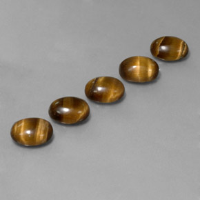 Натуральный коричневый tiger's eye  карата огранка овал, непрозрачный