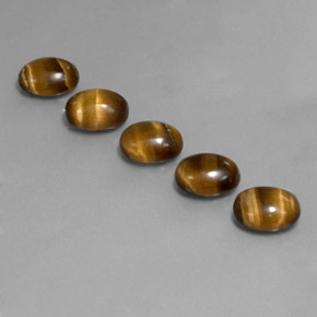 Натуральный коричневый tiger's eye  карата огранка овал, непрозрачный