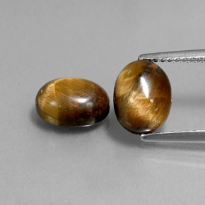 Натуральный коричневый tiger's eye  карата огранка овал, непрозрачный