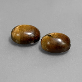 Натуральный коричневый tiger's eye  карата огранка овал, непрозрачный