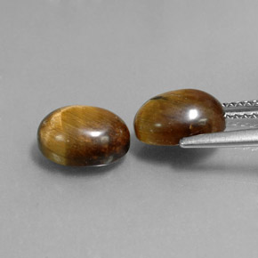 Натуральный коричневый tiger's eye  карата огранка овал, непрозрачный