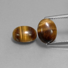 Натуральный коричневый tiger's eye  карата огранка овал, непрозрачный