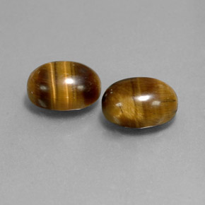 Натуральный коричневый tiger's eye  карата огранка овал, непрозрачный