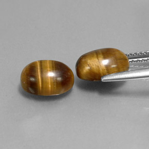 Натуральный коричневый tiger's eye  карата огранка овал, непрозрачный