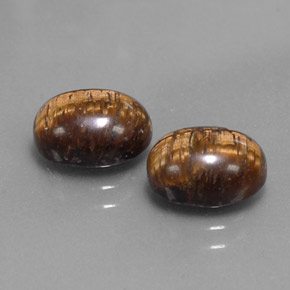 Натуральный коричневый tiger's eye  карата огранка овал, непрозрачный