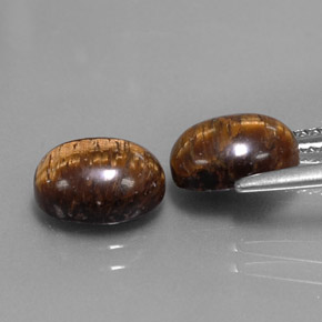 Натуральный коричневый tiger's eye  карата огранка овал, непрозрачный