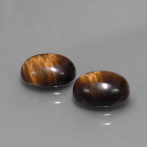 Натуральный коричневый tiger's eye  карата огранка овал, непрозрачный
