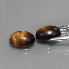 Натуральный коричневый tiger's eye  карата огранка овал, непрозрачный