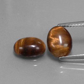 Натуральный коричневый tiger's eye  карата огранка овал, непрозрачный