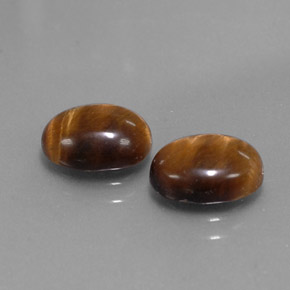 Натуральный коричневый tiger's eye  карата огранка овал, непрозрачный