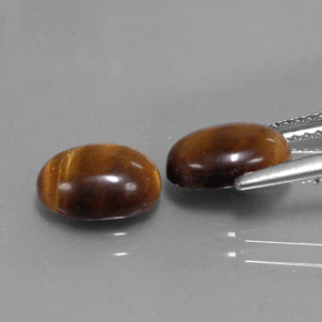 Натуральный коричневый tiger's eye  карата огранка овал, непрозрачный