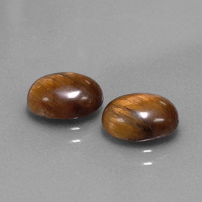 Натуральный коричневый tiger's eye  карата огранка овал, непрозрачный