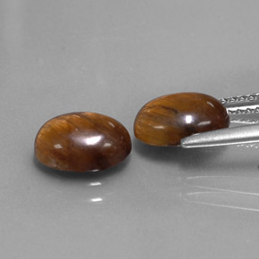 Натуральный коричневый tiger's eye  карата огранка овал, непрозрачный