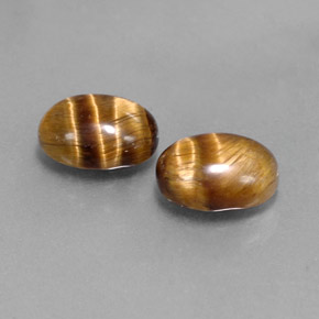 Натуральный коричневый tiger's eye  карата огранка овал, непрозрачный