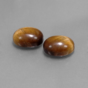 Натуральный коричневый tiger's eye  карата огранка овал, непрозрачный
