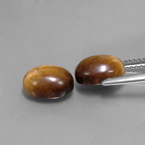 Натуральный коричневый tiger's eye  карата огранка овал, непрозрачный