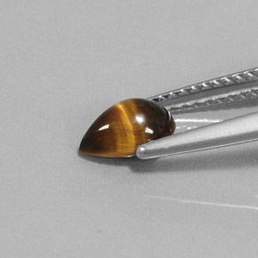 Натуральный коричневый tiger's eye 0,70 карата форма груши, непрозрачный