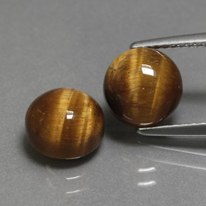 Натуральный коричневый tiger's eye  карата огранка круг, непрозрачный