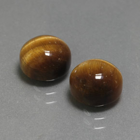 Натуральный коричневый tiger's eye  карата огранка круг, непрозрачный