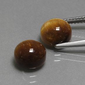 Натуральный коричневый tiger's eye  карата огранка круг, непрозрачный