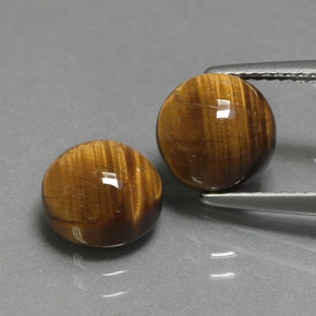 Натуральный коричневый tiger's eye  карата огранка круг, непрозрачный