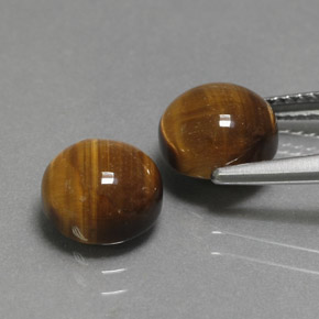 Натуральный коричневый tiger's eye  карата огранка круг, непрозрачный