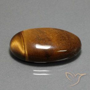34.98 карата, натуральный Темно-коричневая коричневая Тигровый глаз, Овал, Непрозрачный