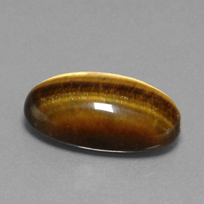 Натуральный коричневый tiger's eye 19,73 карата огранка овал, непрозрачный
