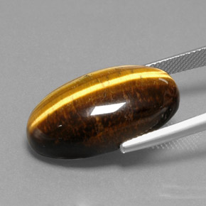 Натуральный коричневый tiger's eye 19,73 карата огранка овал, непрозрачный