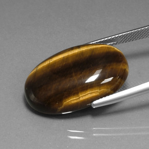 Натуральный коричневый tiger's eye 20,40 карата огранка овал, непрозрачный