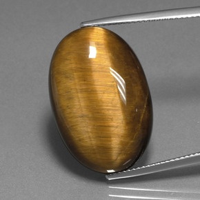 Натуральный коричневый tiger's eye 20,98 карата огранка овал, непрозрачный